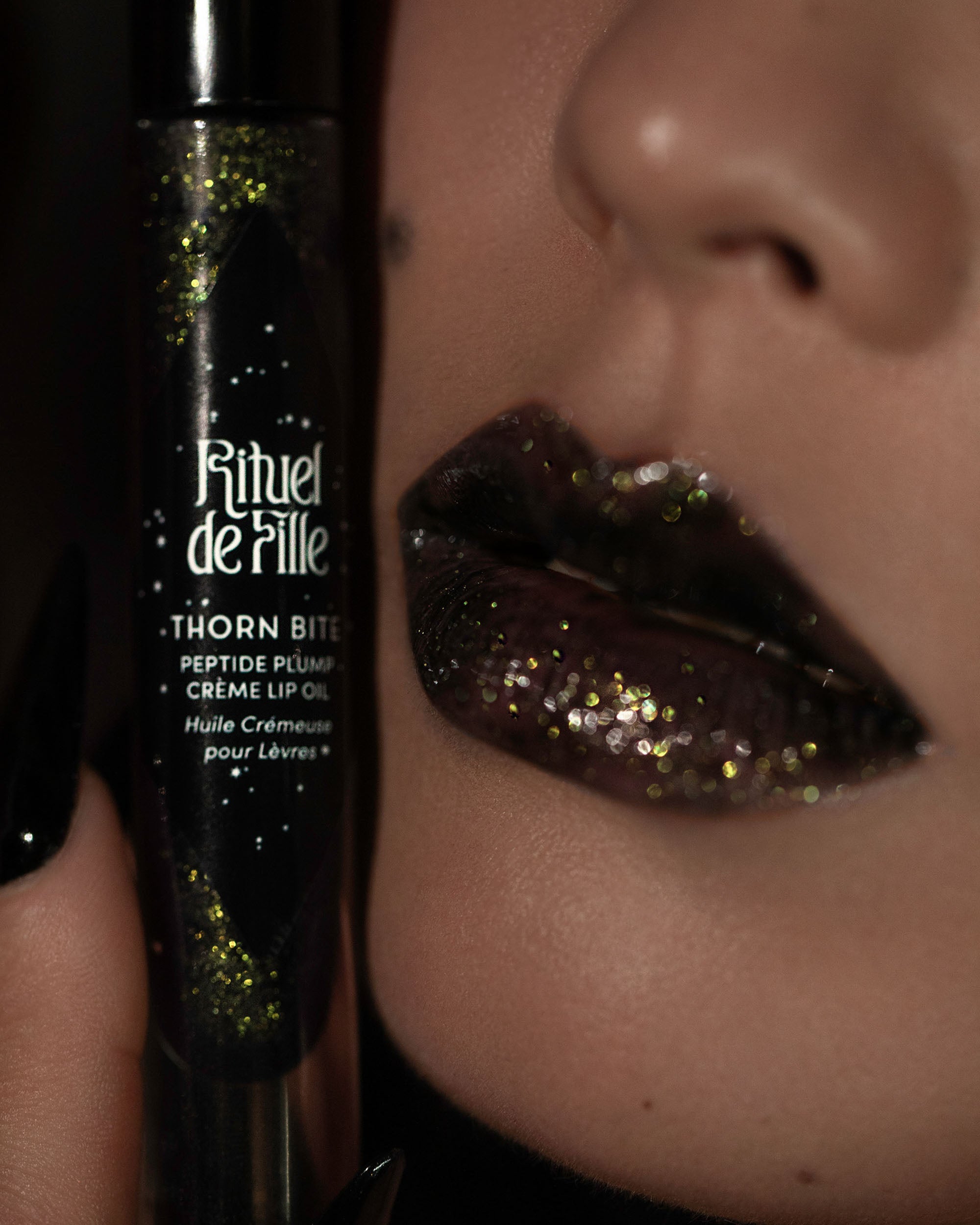 Campaign image featuring model wearing Night Bloom lip oil