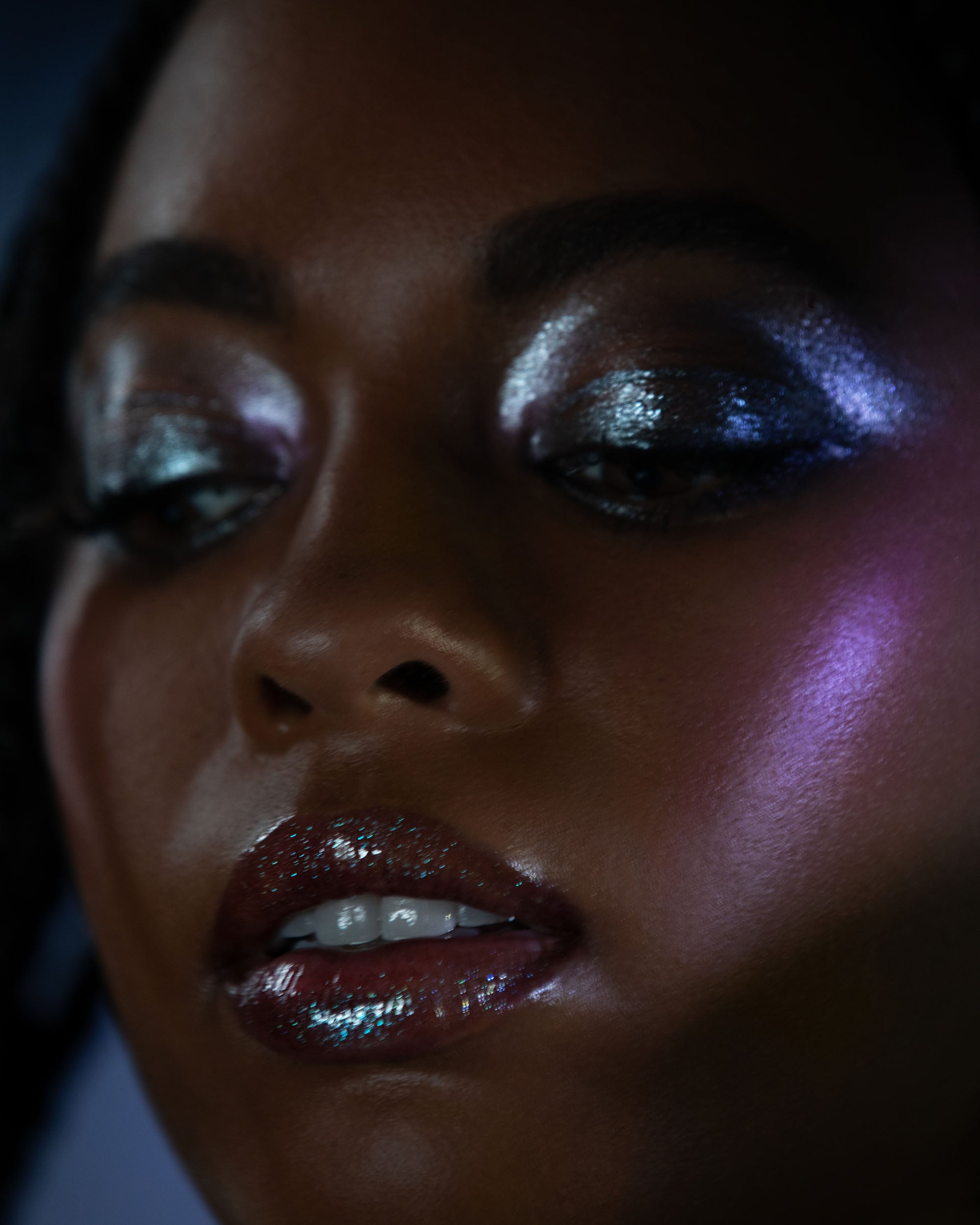 Close-up of a person's face with dramatic makeup