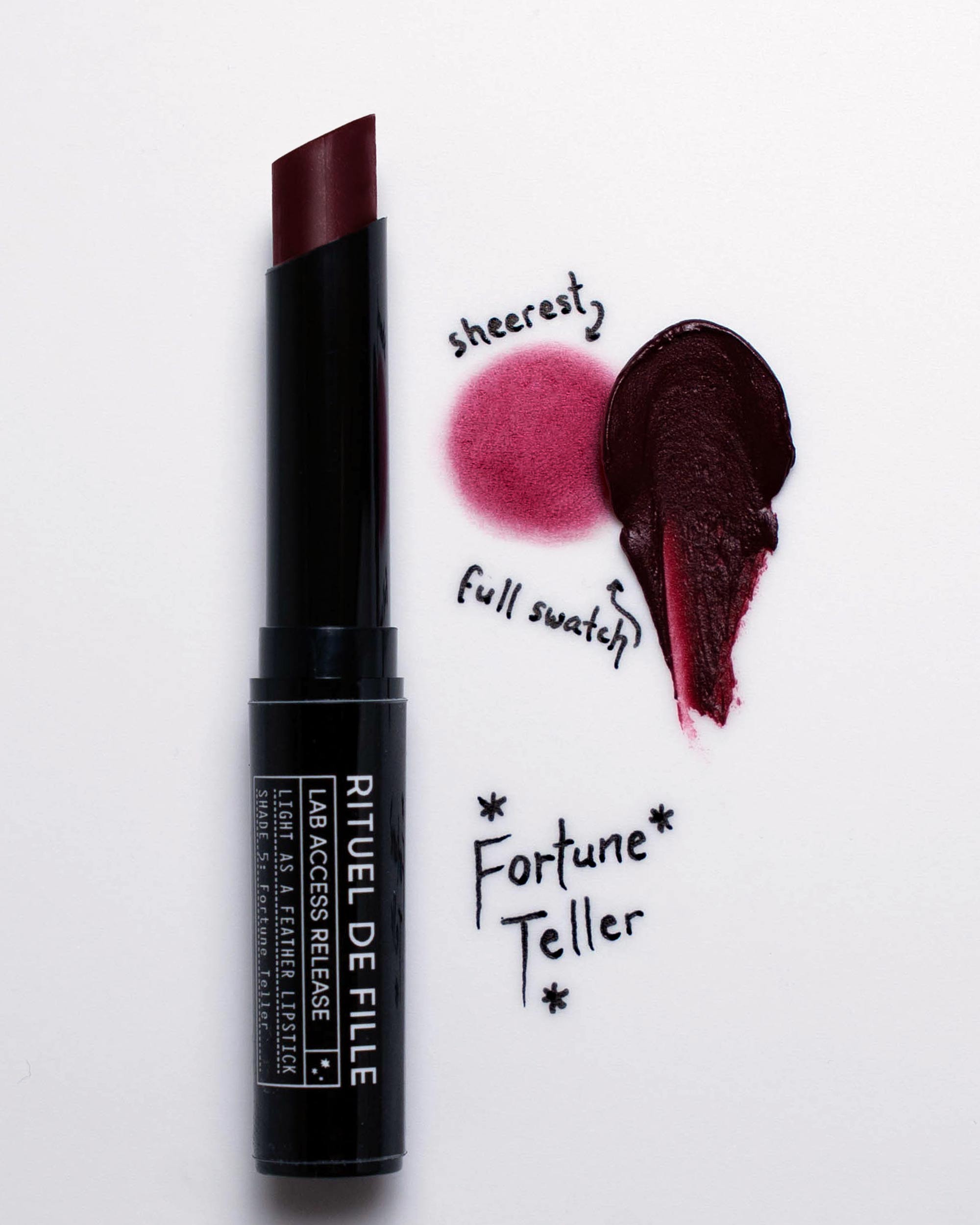 Lipstick with swatches labeled 'sheerest', 'full swatch', and 'Fortune Teller' on a white background.