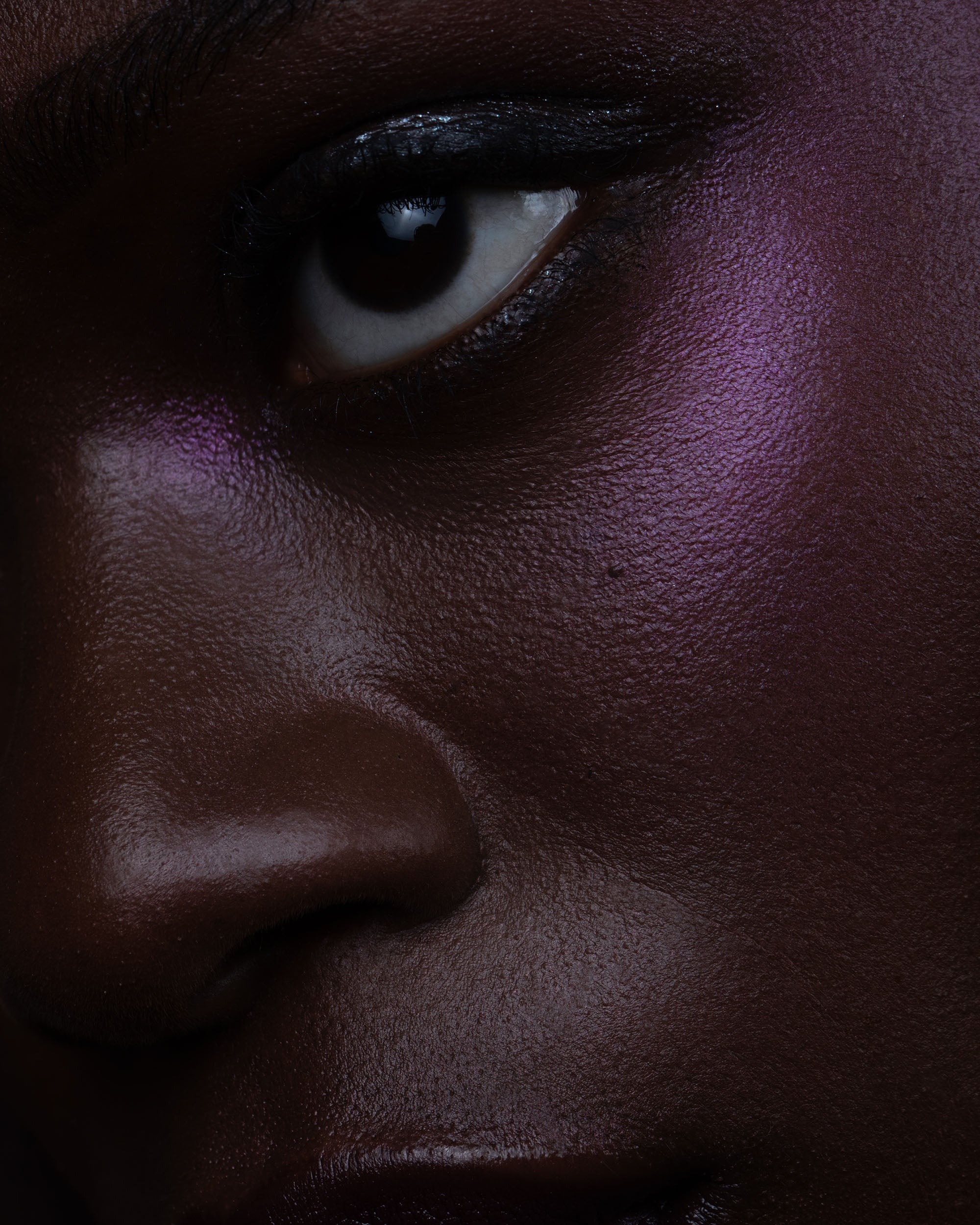 Close-up of a person's eye with dark makeup