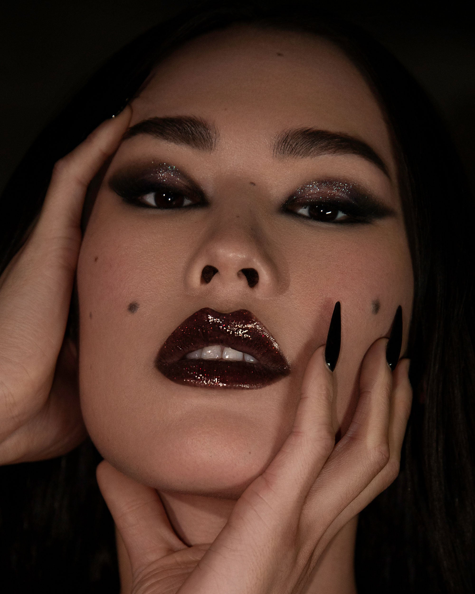 Model wearing Night Flower Thorn Bite lip oil shade