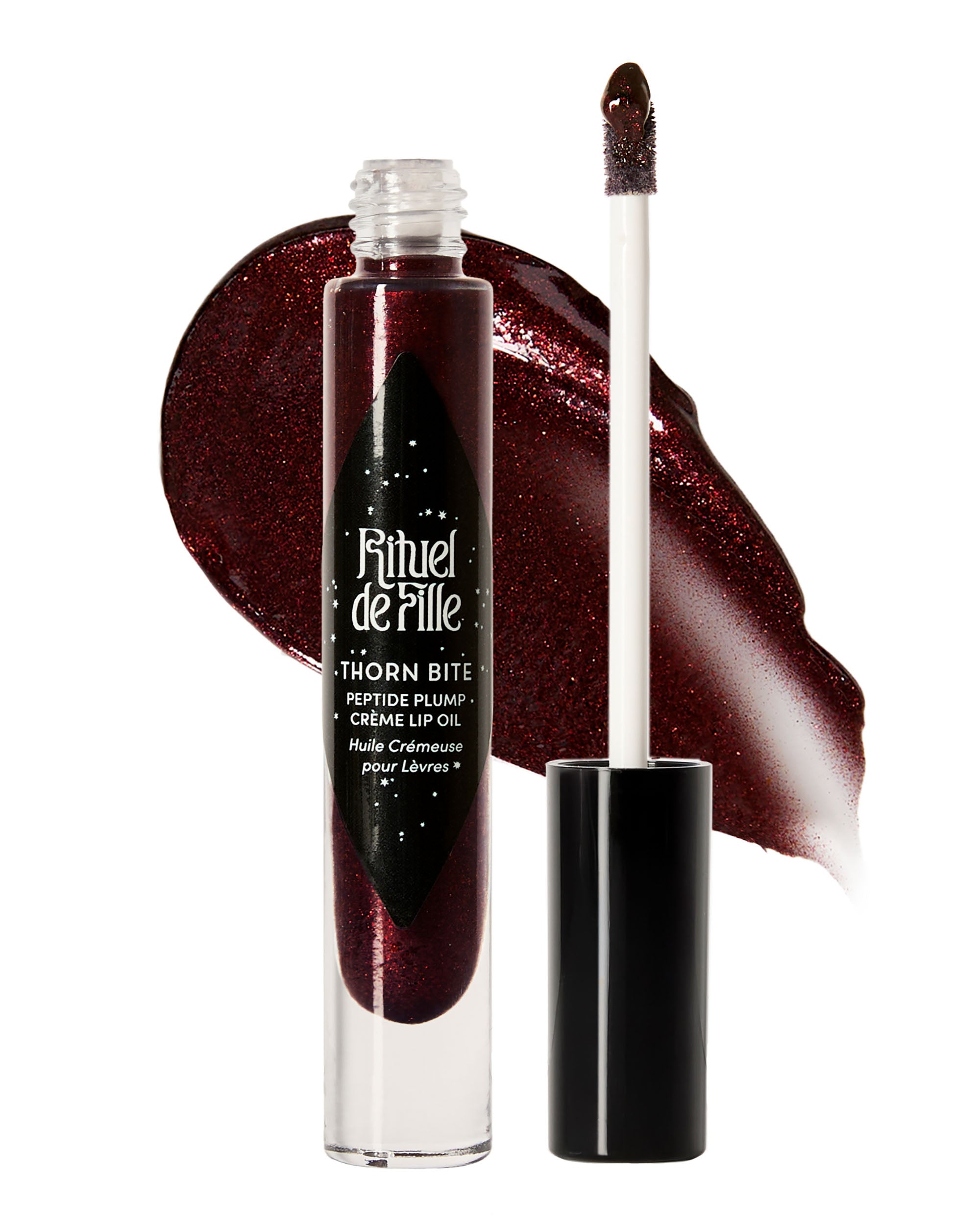 Tube of Night Flower Thorn Bite lip oil shown with swatch