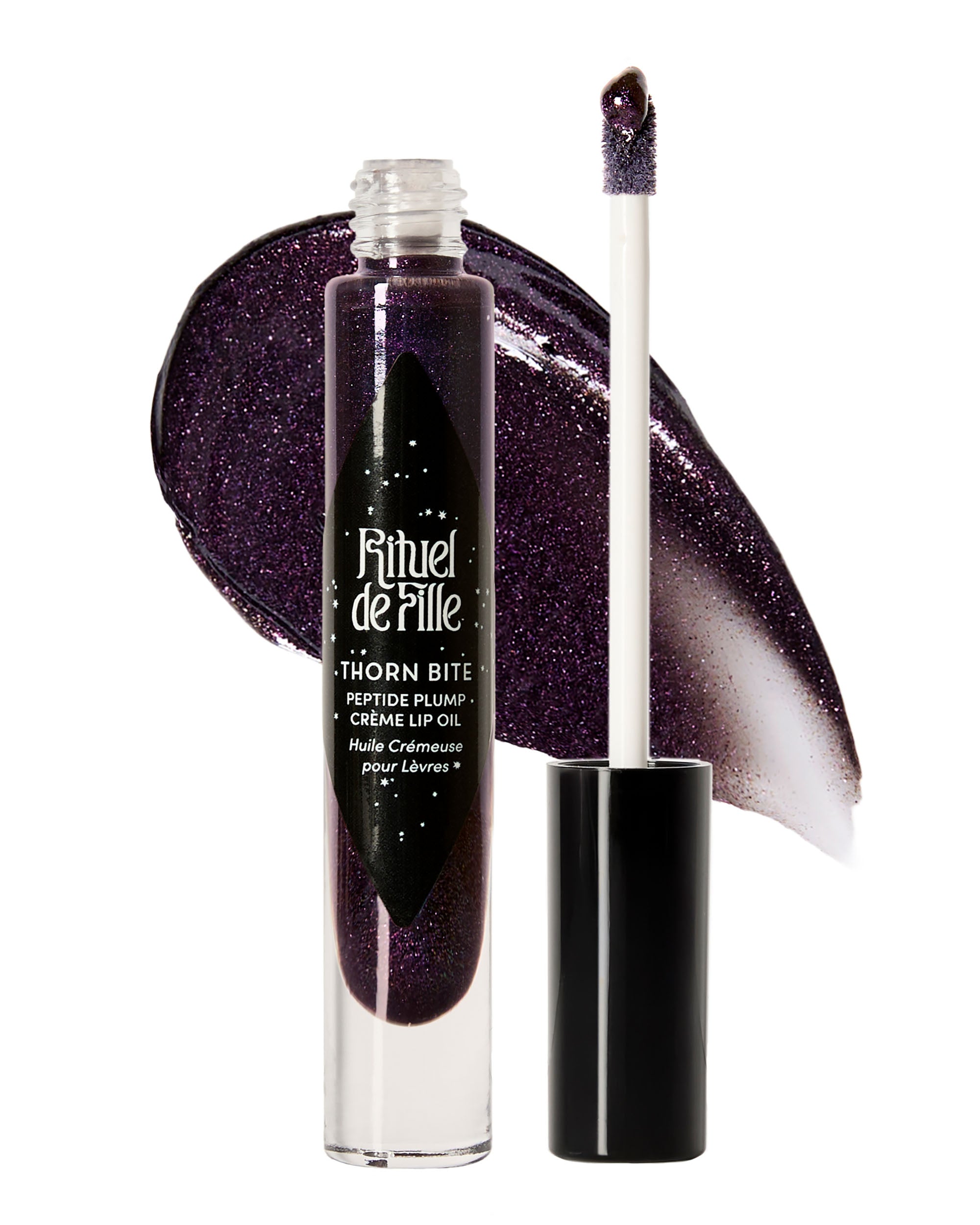 Tube of Night Bloom Thorn Bite lip oil shown with swatch