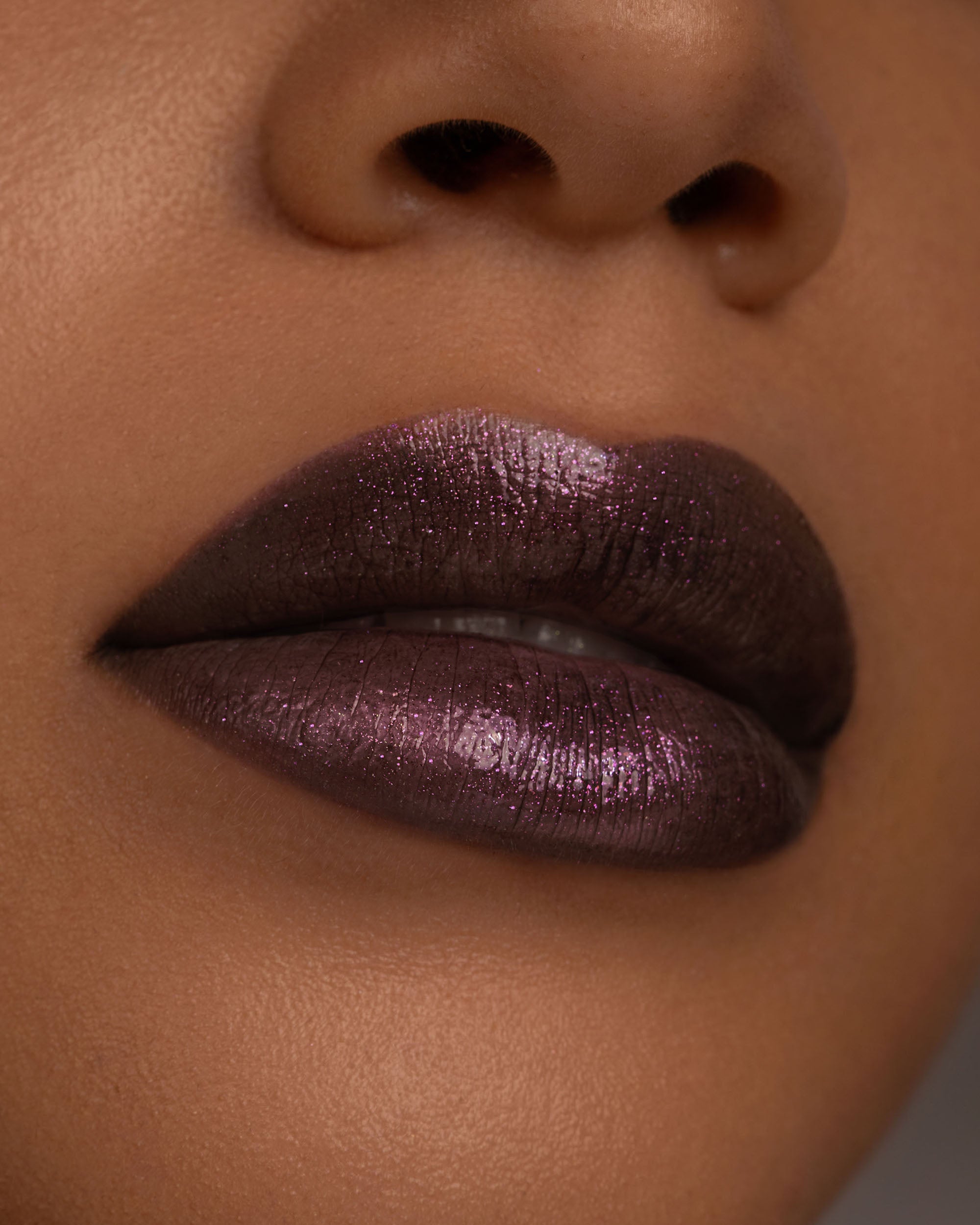 Close-up lip macro of Night Bloom Thorn Bite lip oil