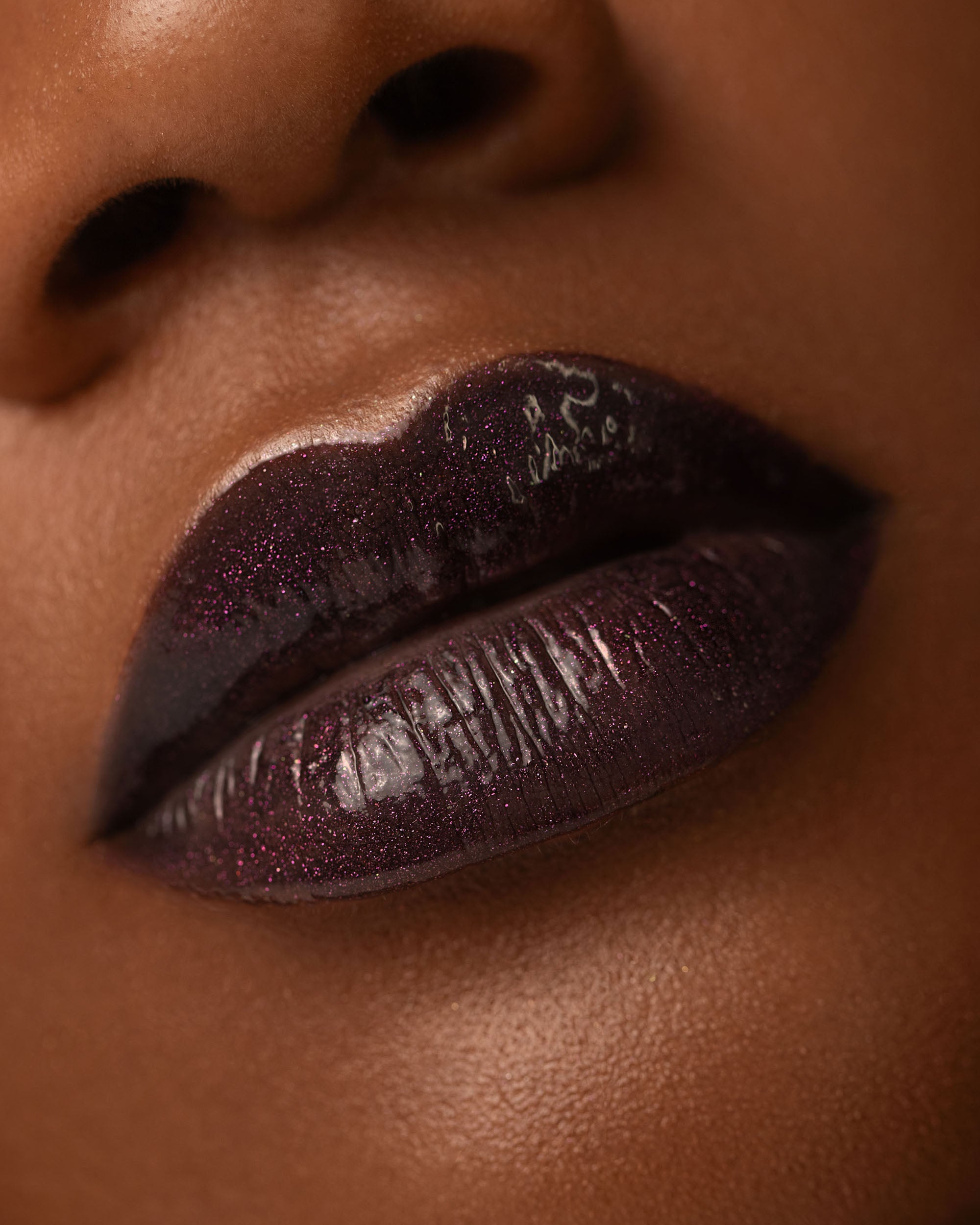 Close-up lip macro of Night Bloom Thorn Bite lip oil