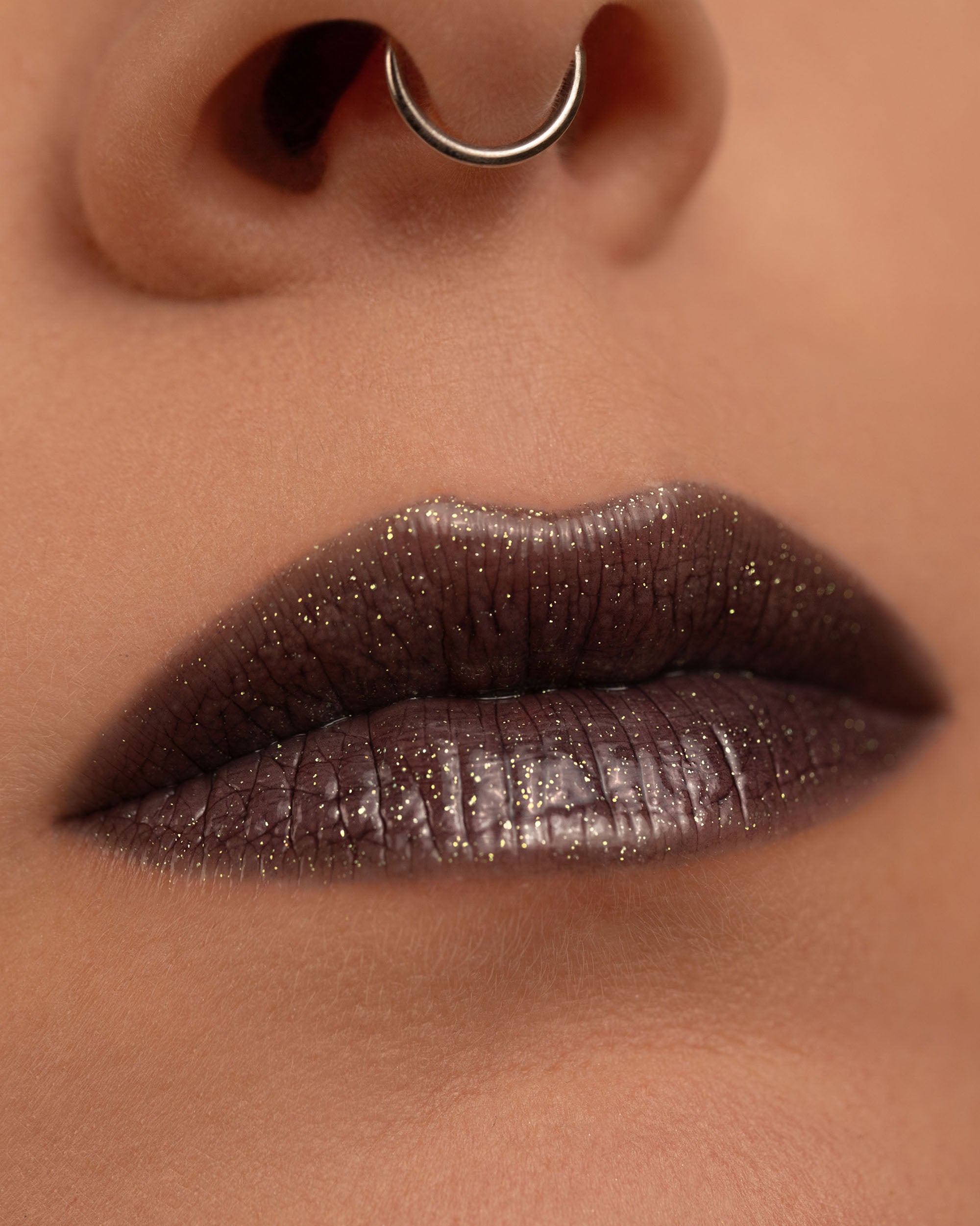 Close-up lip macro of Night Glow Thorn Bite lip oil