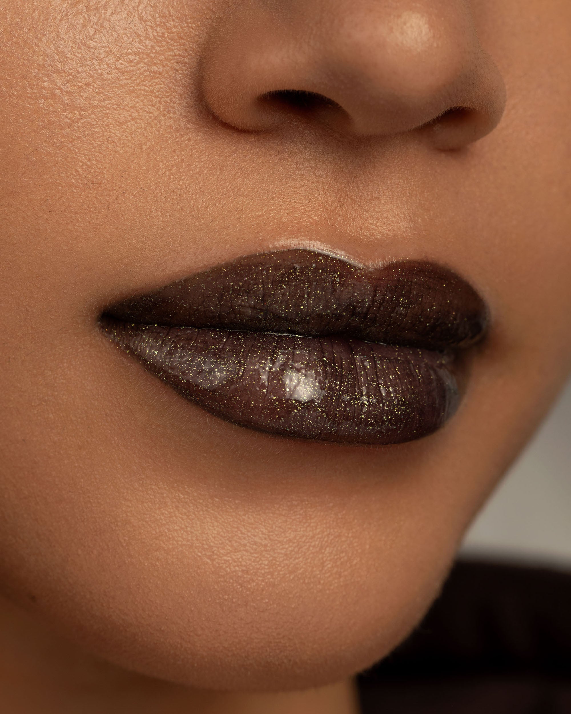 Close-up lip macro of Night Glow Thorn Bite lip oil