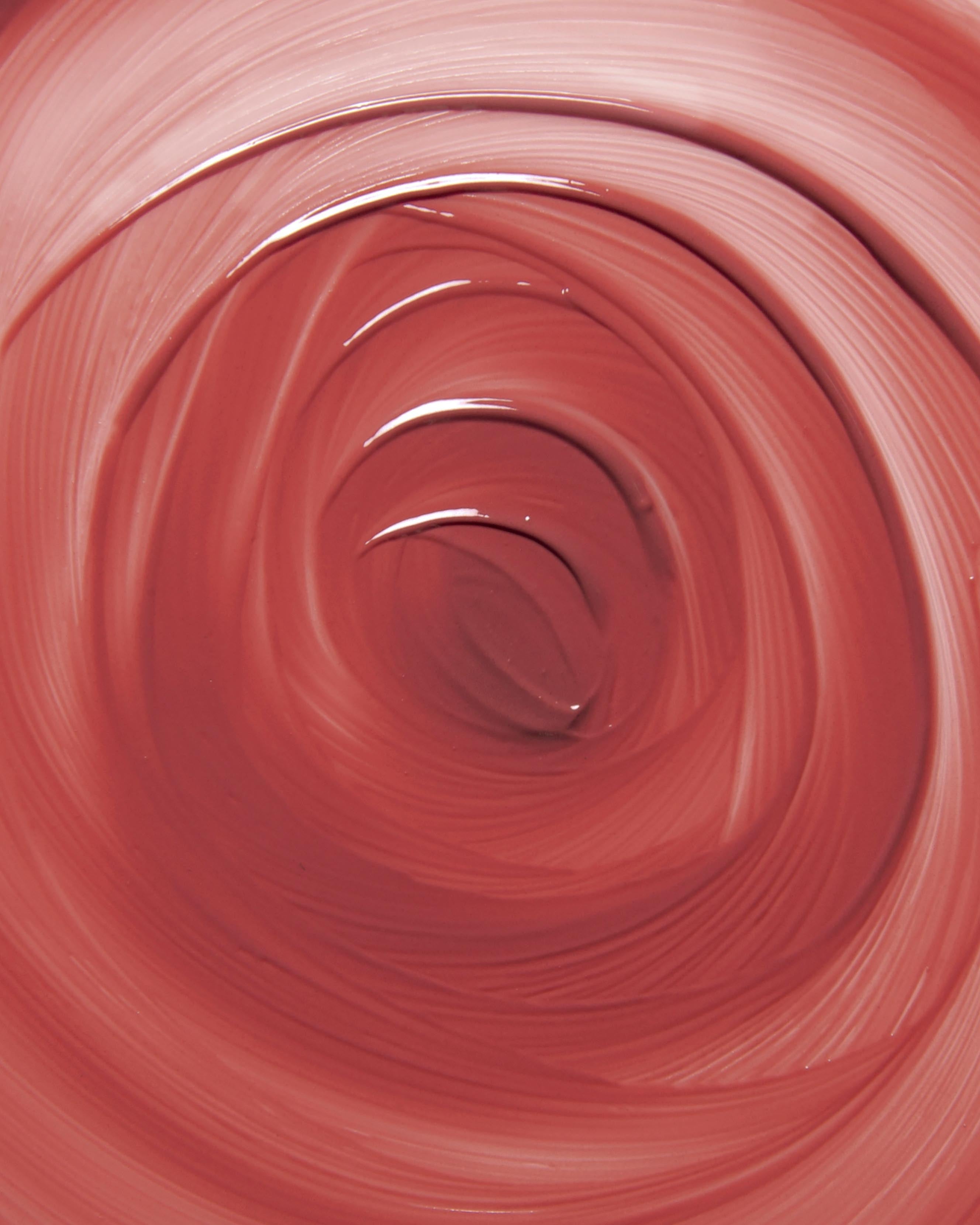 Close-up of rose pink makeup swirled in a circular pattern