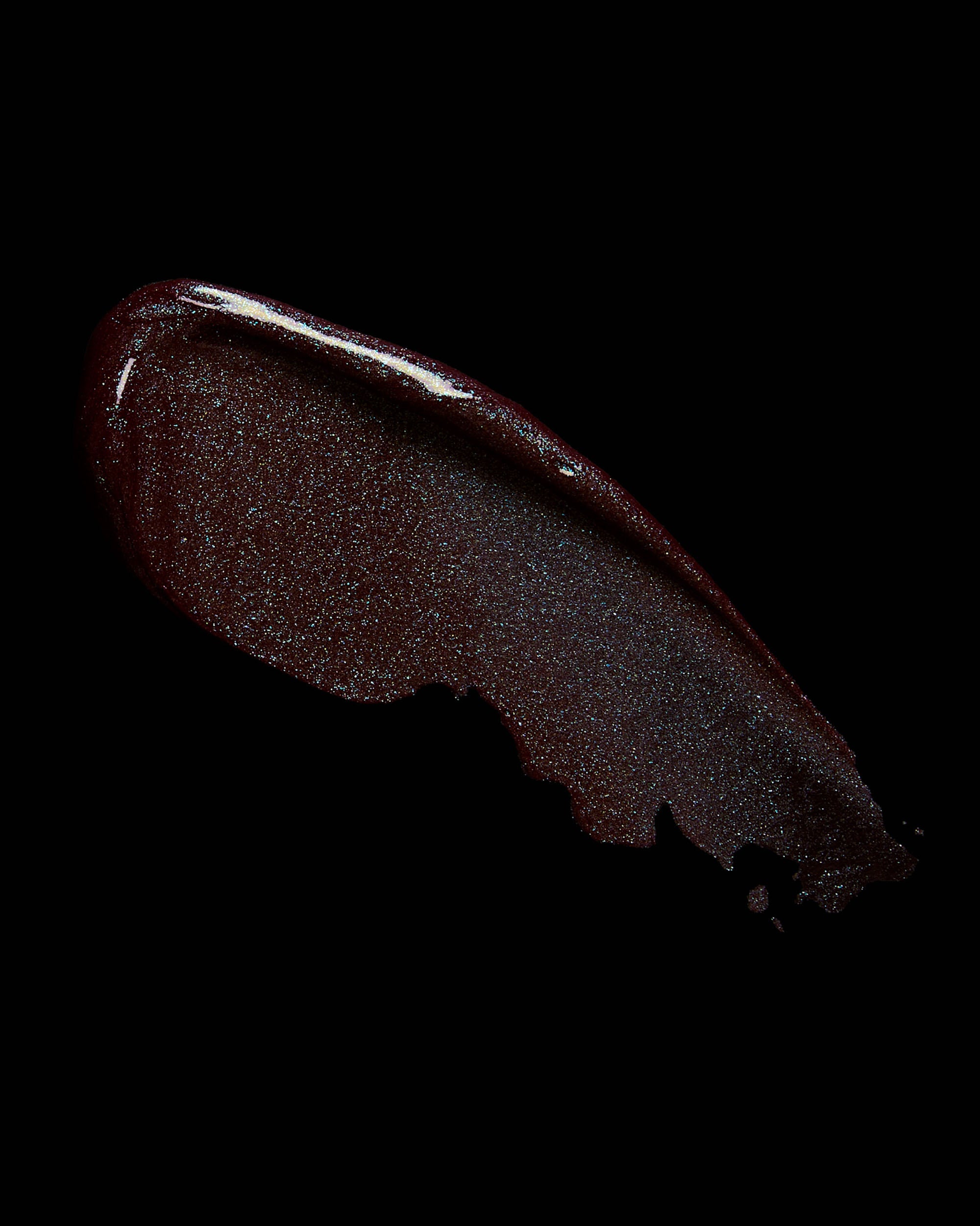 Dark brown lip gloss swatch on a black background