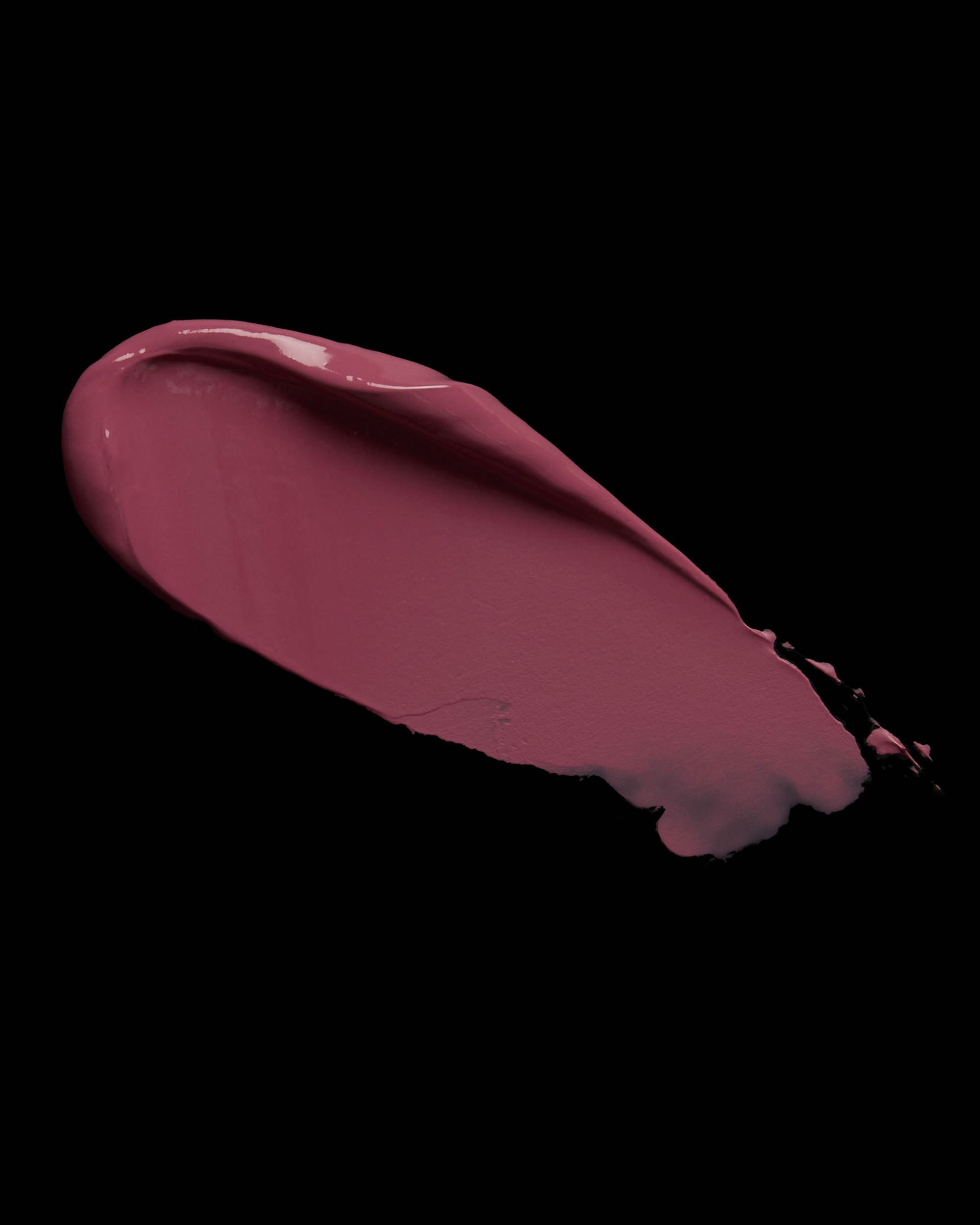 Pink blush swatch on a black background