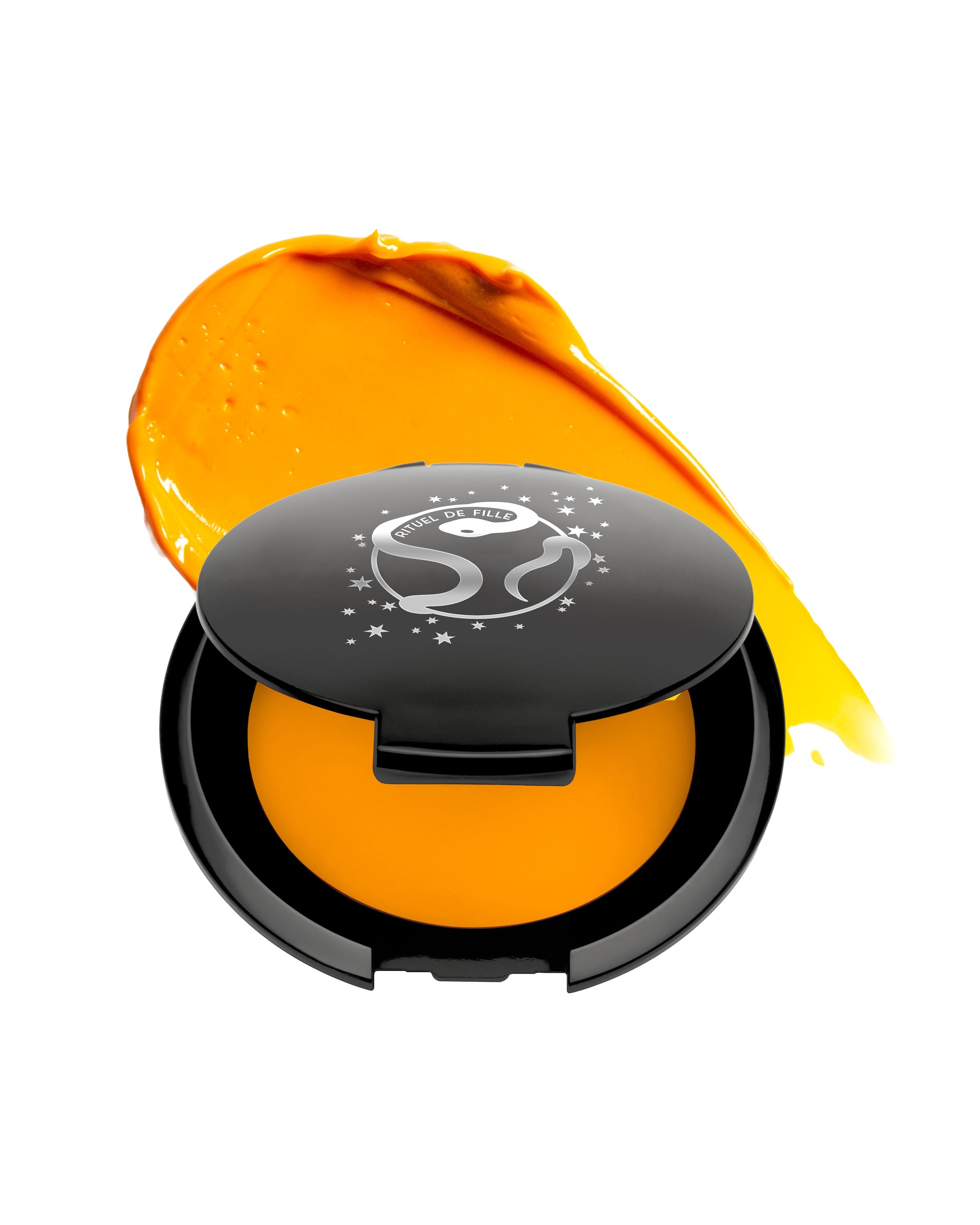 Bright yellow makeup in black compact with Rituel de Fille logo on a white background