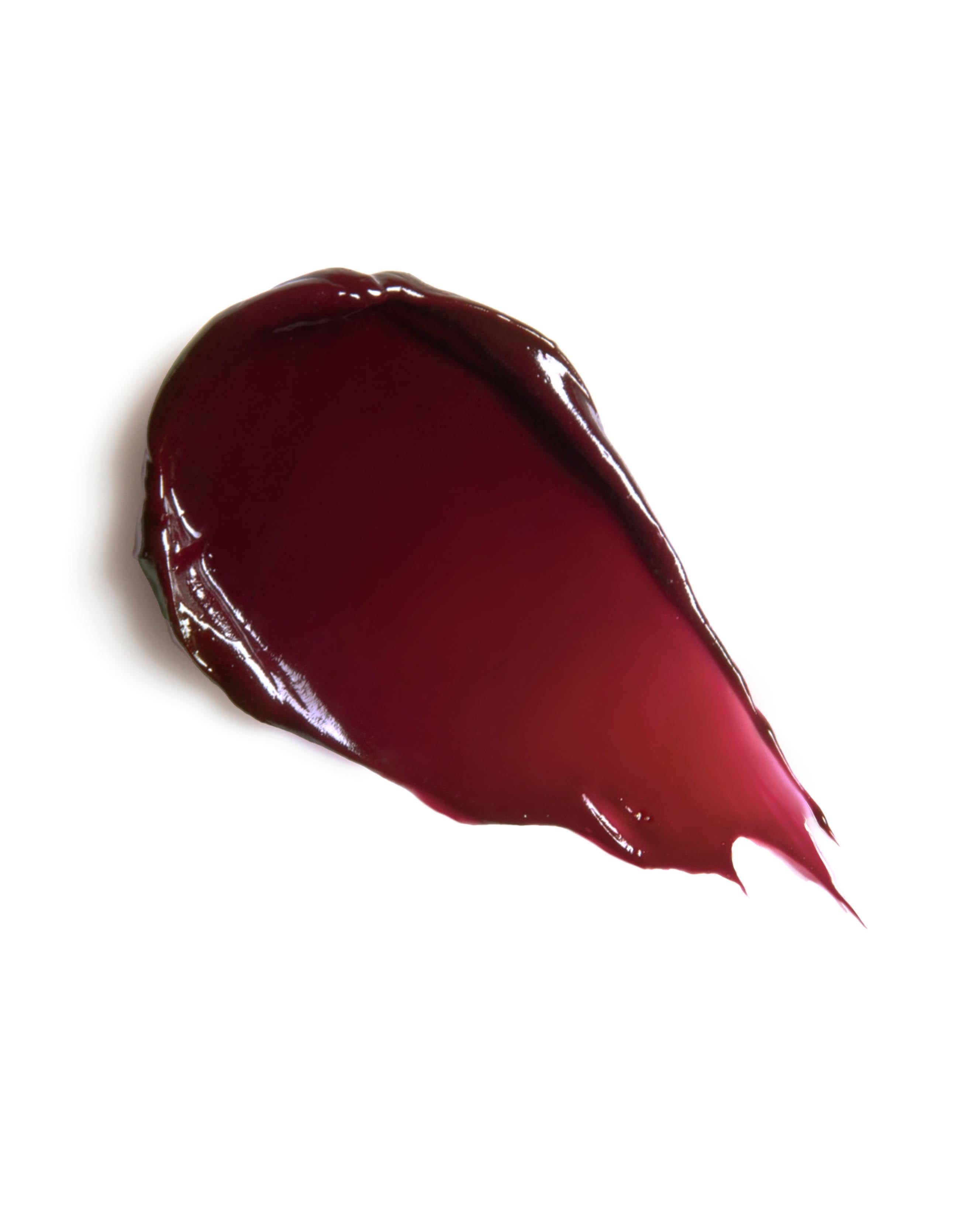 Burgundy red makeup swatch on a white background