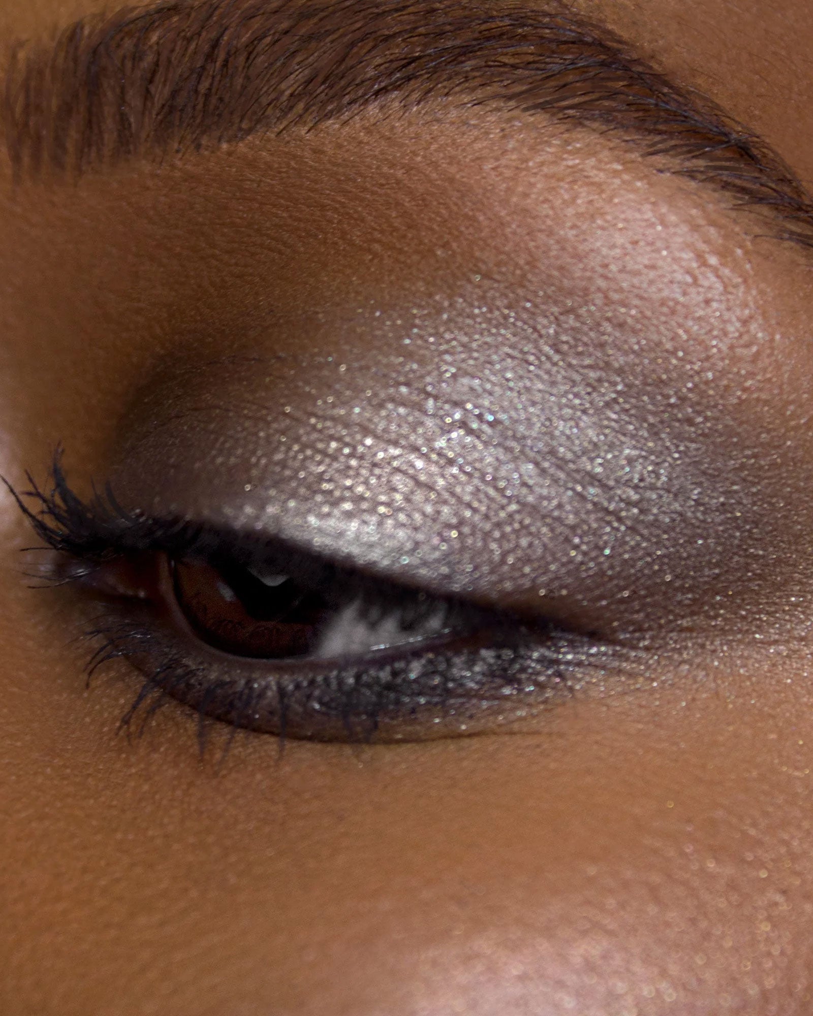 Close-up of a person's eye with smoky eyeshadow